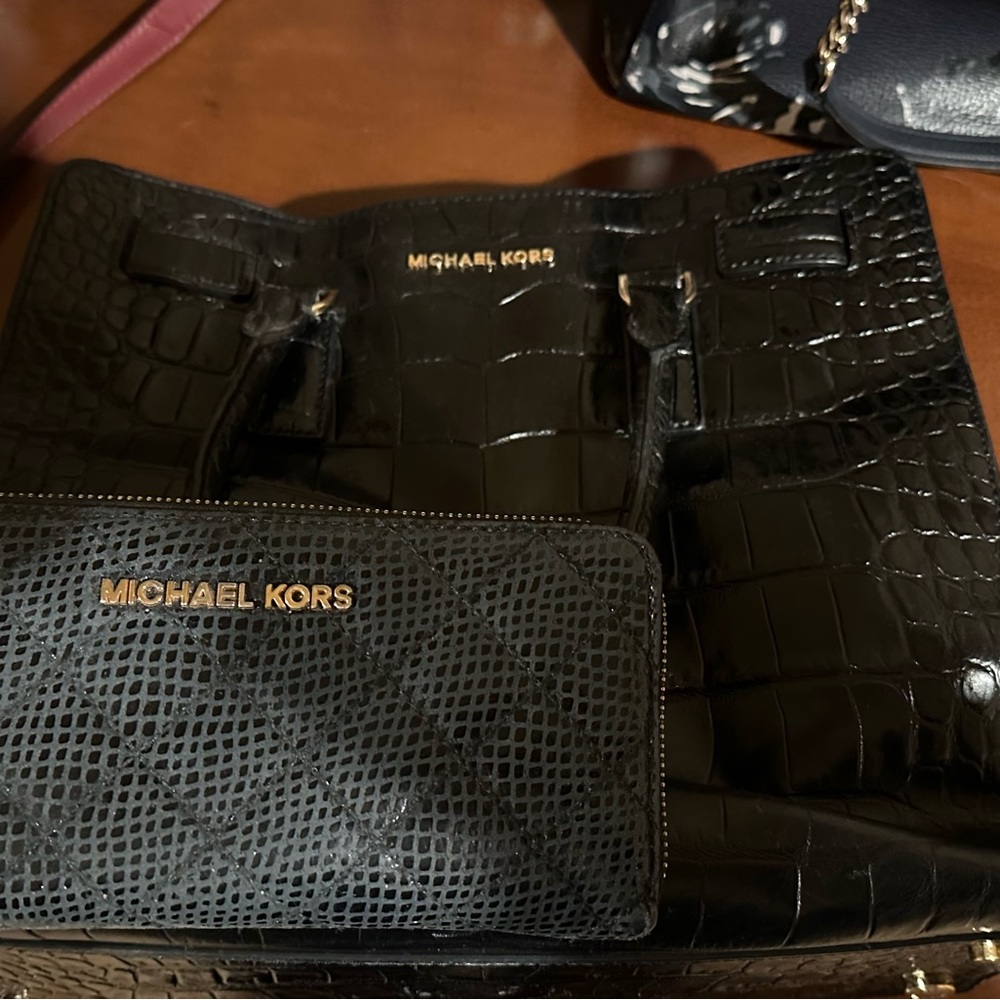 Black Michael Kors wallet and purse with gold details